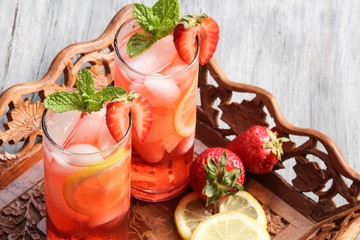 Mojito cocktail with strawberries rum mint and lemon