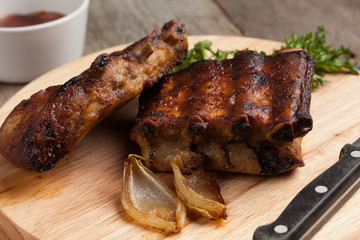 Barbecue pork  ribs on a white plate.