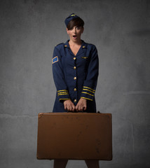 hostess with suitcase and surprising face
