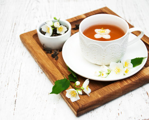 Cup of tea with jasmine flowers