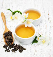 Cup of tea with jasmine flowers