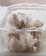 Raw garlic close up on white