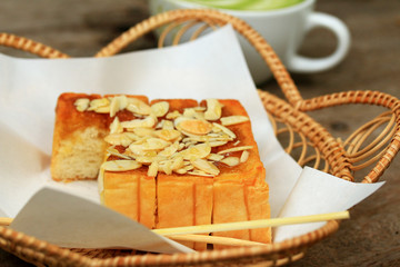 Toast bread topped with honey and almond.