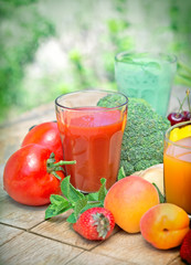 Tomato juice and other juices on table