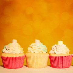 Cupcake Border. Orange Birthday Party Background with Copy Space