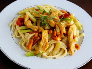grilled chicken meat with pasta and vegetables