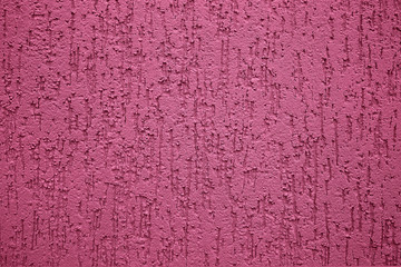 pink wall background with an abstract relief pattern closeup