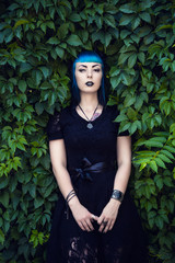 Beautiful goth girl with bright blue hair