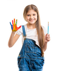 Naklejka premium Portrait of girl holding paintbrush and showing painted hand