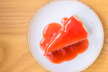 Strawberry sweet cake and strawberry jam on white dish