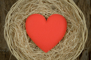 single red heart shape in basket