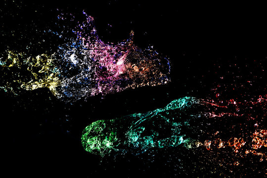 Abstract colorful Water splash isolated on black