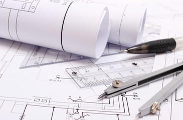 Rolled electrical diagrams and accessories for drawing
