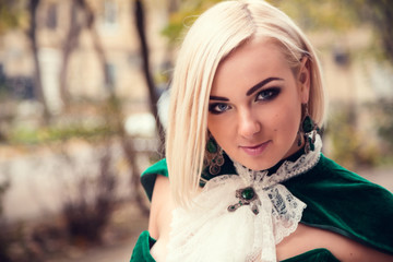 A woman like a princess in an vintage dress in fairy park