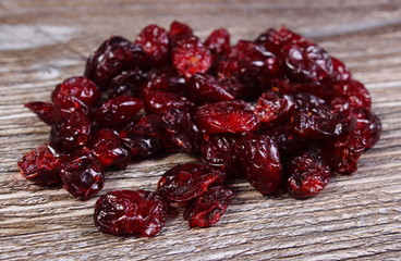 Heap of red cranberries on wooden table