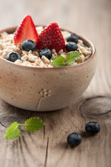 Breakfast oatmeal with milk and berries