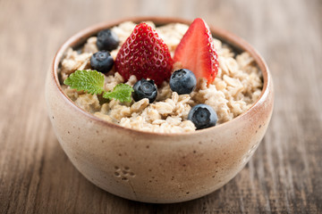 Breakfast oatmeal with milk and berries