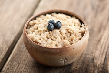 Breakfast oatmeal with milk and berries