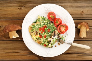 Porcini mushrooms omelette with tomatoes and scallion with two w