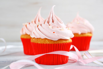 Cupcakes with cream on the table