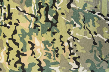 Multicam military camouflage fabric texture background © ognjeno