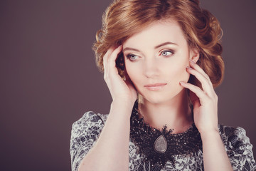 Studio photo of a young woman in retro style