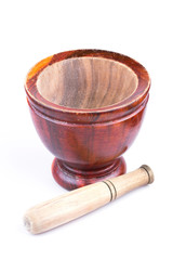 wooden mortar and pestle isolated on white background