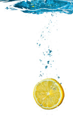 Fototapeta na wymiar Lemon In Water Splash