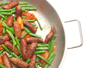 fried merguez sausages with green beans and tomatoes