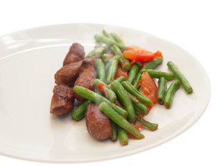 fried merguez sausages with green beans and tomatoes
