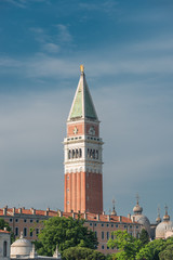 Fototapeta premium Campanile tower at Piazza San Marco and gondolers, Venice, Italy