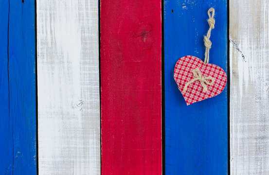 Heart Hanging On Red, White And Blue Wood Background