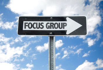 Focus Group direction sign with sky background