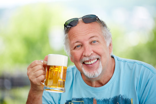 Mature man with glass of beer