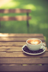 Latte Art coffee with coffee bean vintage color