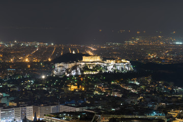 Fototapeta premium Acropolis in Athens with the city lights as background. Night view. 