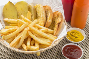 Traditional French fries with ketchup and bread