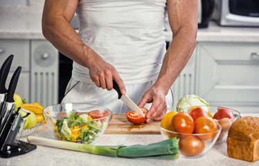 man cutting vegetables