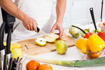 man cutting vegetables