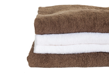 Fototapeta na wymiar White and brown towel isolated on white background