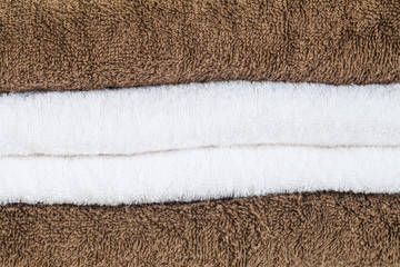 Fototapeta na wymiar Close - up stack of White and brown towel