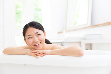 young asian woman in bathroom