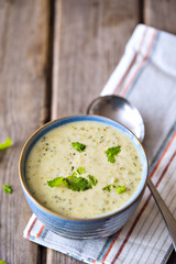 Bowl of broccoli and cheddar cheese soup