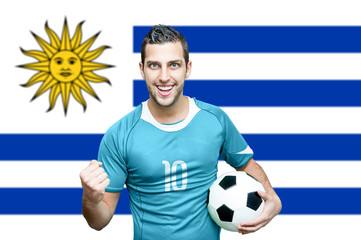 Uruguayan fan celebrates on Uruguay flag background