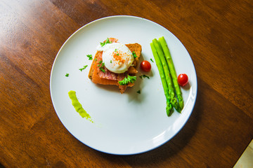 Sandwich with poached egg, parma ham and Salmon