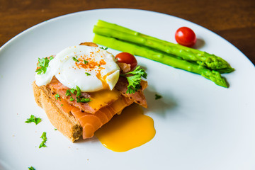 Sandwich with poached egg, parma ham and Salmon
