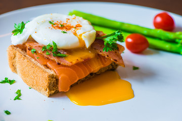 Sandwich with poached egg, parma ham and Salmon