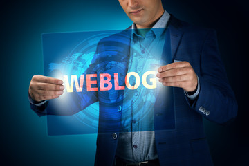 Businessman holding a transparent screen with an inscription a w