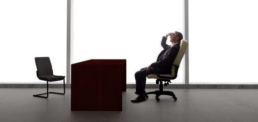 Businessman with an empty chair waiting for a late client