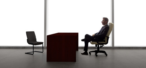 Businessman with an empty chair waiting for a late client